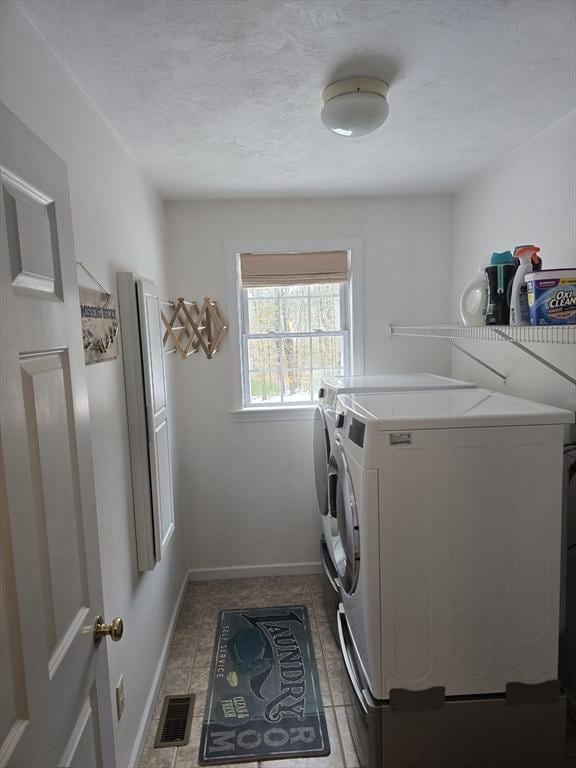 132 Bean Porridge Hill Rd, Westminster, MA 01473 - laundry area featuring independent washer and dryer, light tile patterned floors, baseboards, and a textured ceiling