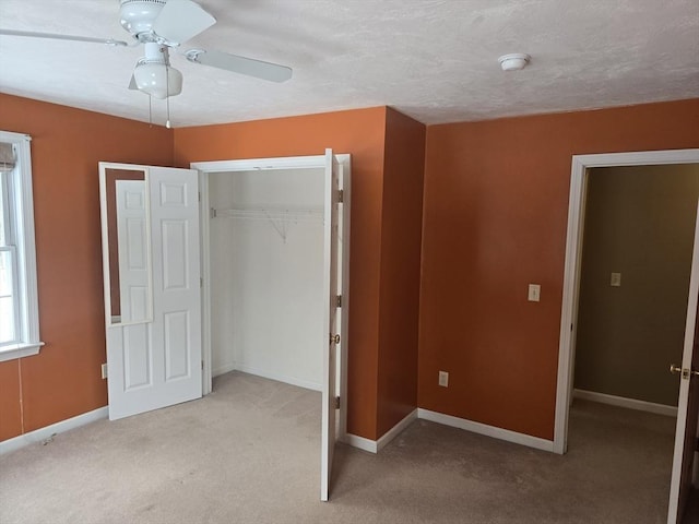 132 Bean Porridge Hill Rd, Westminster, MA 01473 - unfurnished bedroom with a closet, light colored carpet, baseboards, and ceiling fan
