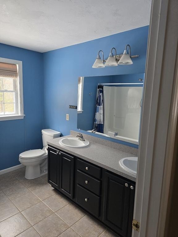 132 Bean Porridge Hill Rd, Westminster, MA 01473 - bathroom featuring tile patterned floors, toilet, double vanity, curtained shower, and baseboards
