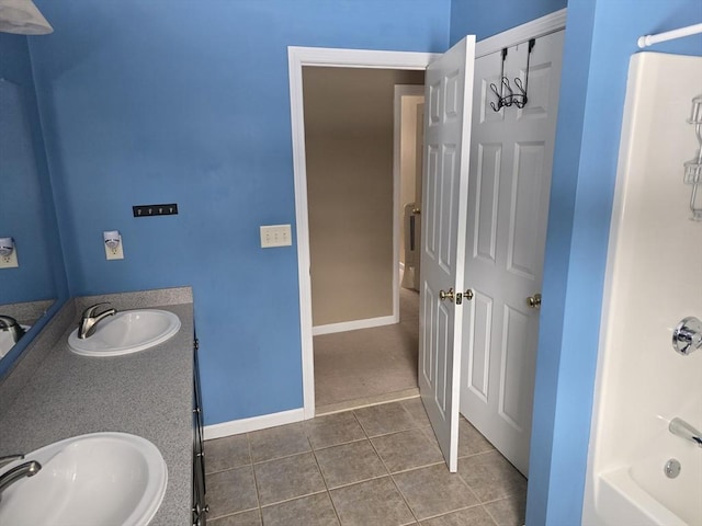 132 Bean Porridge Hill Rd, Westminster, MA 01473 - full bath featuring tile patterned floors, baseboards, shower / tub combination, and double vanity