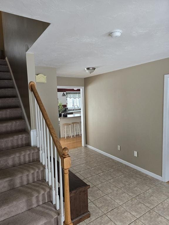 132 Bean Porridge Hill Rd, Westminster, MA 01473 - staircase with tile patterned floors and baseboards