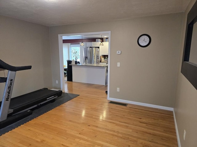 132 Bean Porridge Hill Rd, Westminster, MA 01473 - workout room with light wood finished floors and baseboards