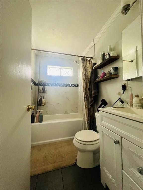 3 Fernview Ave Unit 11, North Andover, MA 01845 - bathroom with vanity, shower / bath combo with shower curtain, tile patterned flooring, toilet, and ornamental molding