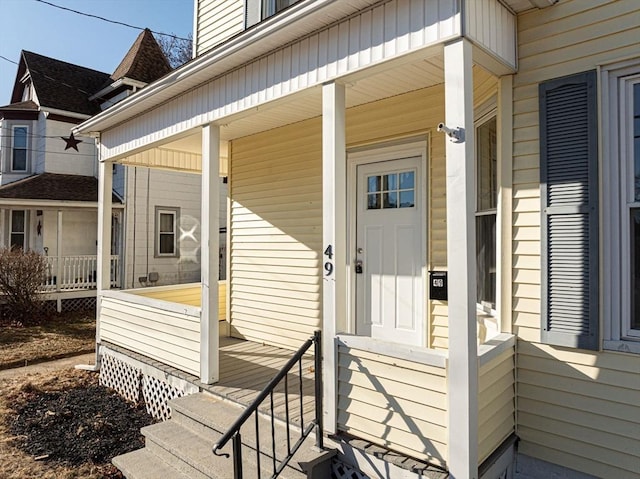 view of exterior entry featuring a porch