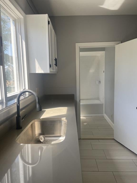 38 Chatham St, Lynn, MA 01902 - kitchen featuring a sink and white cabinets