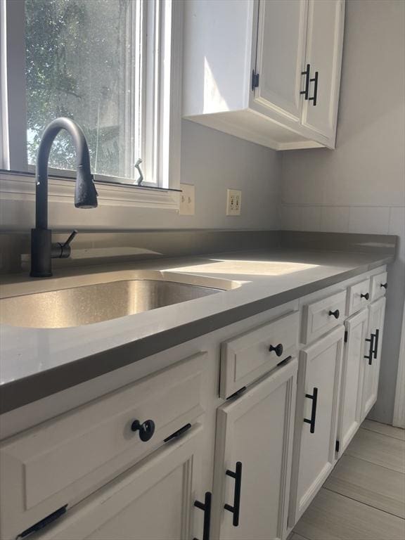 38 Chatham St, Lynn, MA 01902 - kitchen featuring white cabinets and dark countertops