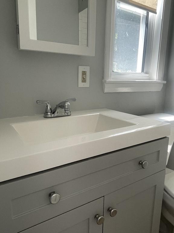 38 Chatham St, Lynn, MA 01902 - bathroom featuring vanity and toilet