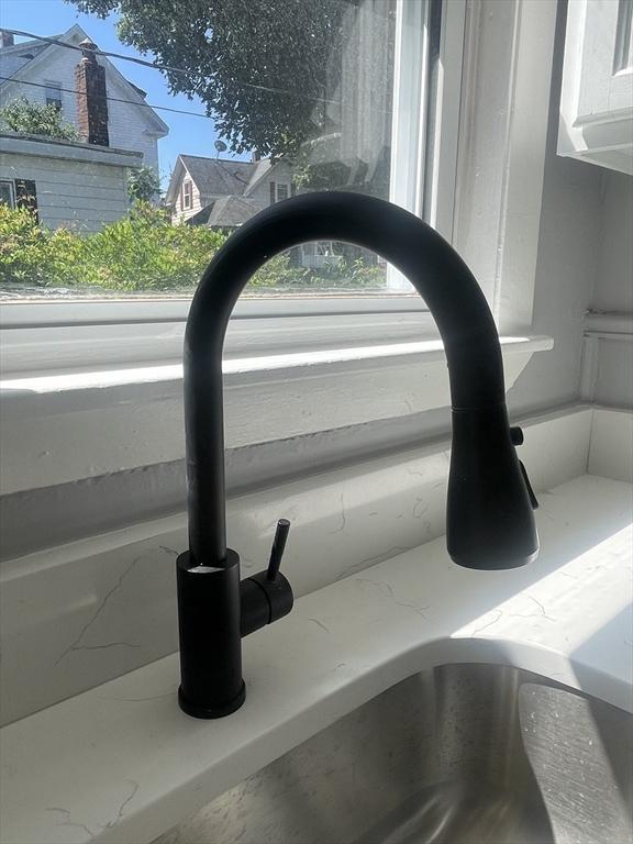 38 Chatham St, Lynn, MA 01902 - kitchen view of a sink and light stone countertops