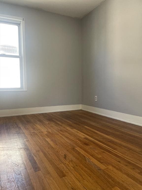 38 Chatham St, Lynn, MA 01902 - spare room with dark wood-type flooring and baseboards