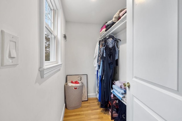 spacious closet featuring light wood-style floors