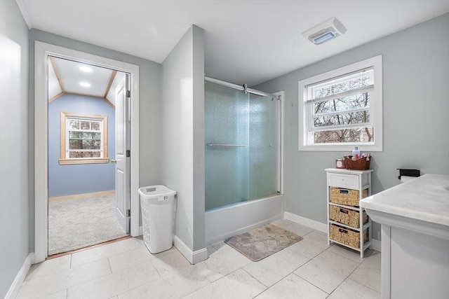 bathroom featuring enclosed tub / shower combo, visible vents, and baseboards