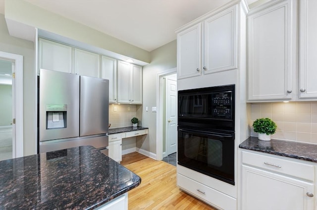 138 Fairview St, Holliston, MA 01746 - kitchen featuring black appliances, tasteful backsplash, light wood finished floors, and white cabinetry