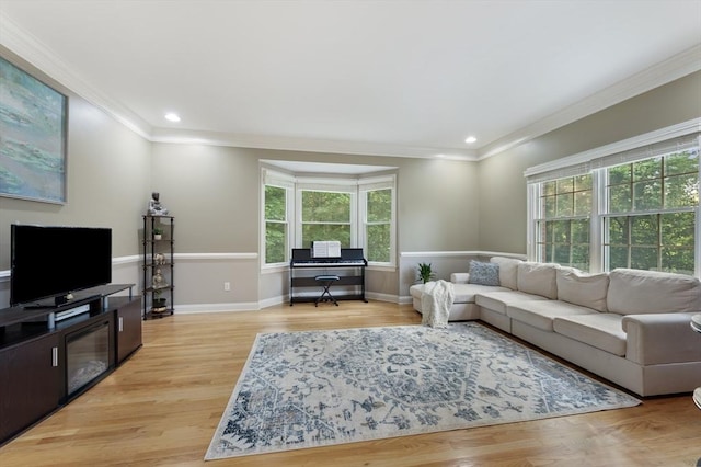 138 Fairview St, Holliston, MA 01746 - living room with plenty of natural light, crown molding, light wood-style floors, and recessed lighting
