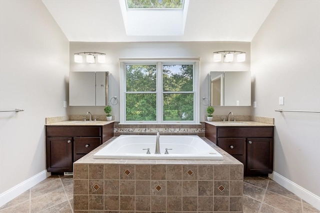 138 Fairview St, Holliston, MA 01746 - full bath with a bath, two vanities, and a skylight