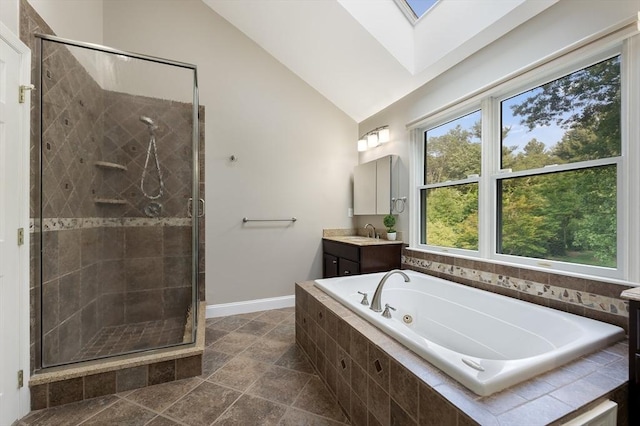 138 Fairview St, Holliston, MA 01746 - full bath with vanity, a whirlpool tub, a stall shower, a skylight, and high vaulted ceiling