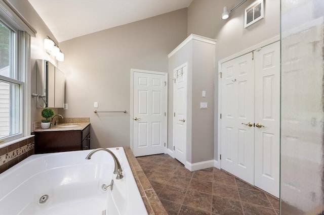 138 Fairview St, Holliston, MA 01746 - full bath with a whirlpool tub, vanity, high vaulted ceiling, and a closet