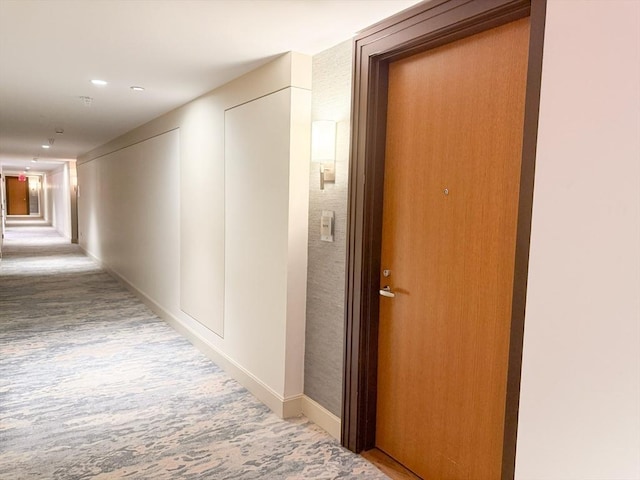 hall with carpet, recessed lighting, and baseboards