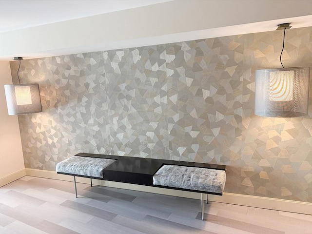 interior space featuring baseboards and wood finished floors