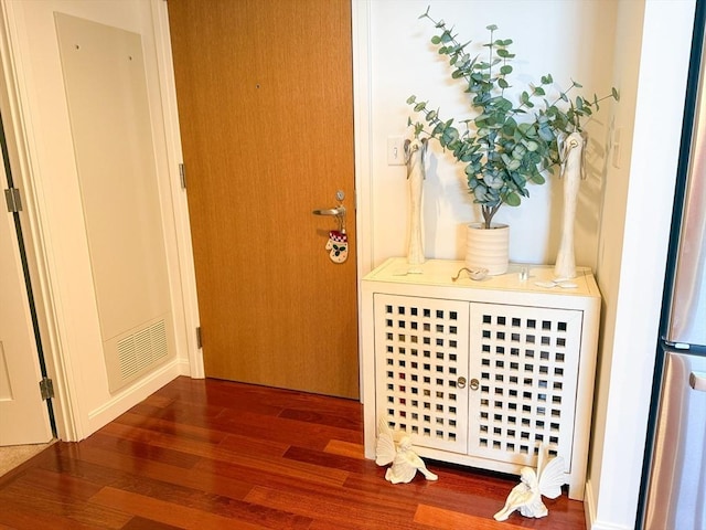 doorway featuring wood finished floors