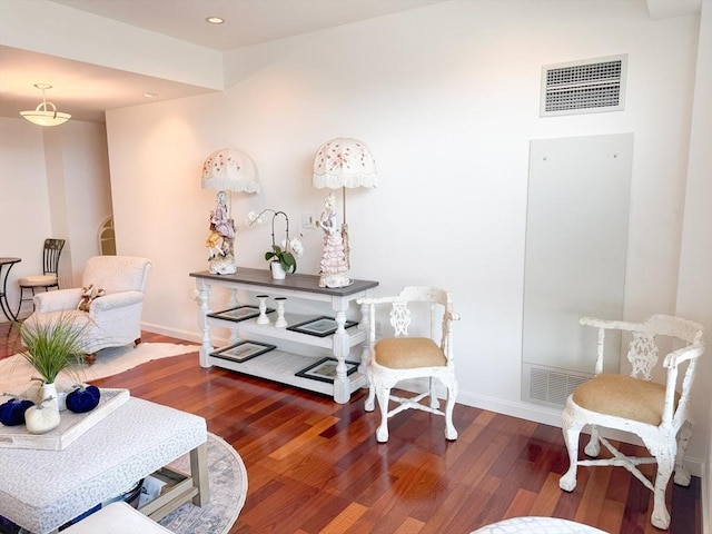 sitting room featuring wood finished floors, baseboards, and recessed lighting