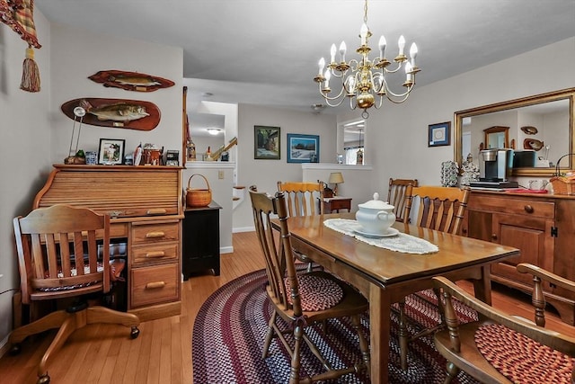 dining area featuring a chandelier and hardwood / wood-style flooring
