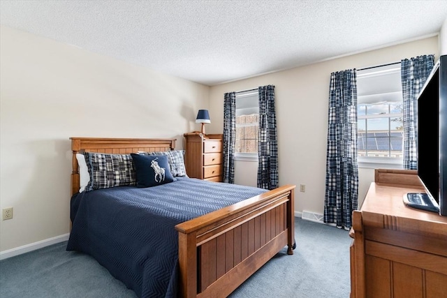 carpeted bedroom with a textured ceiling