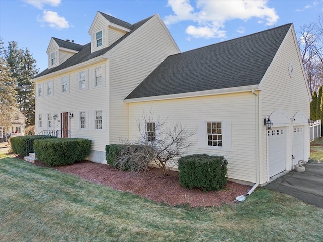 view of side of home featuring a yard