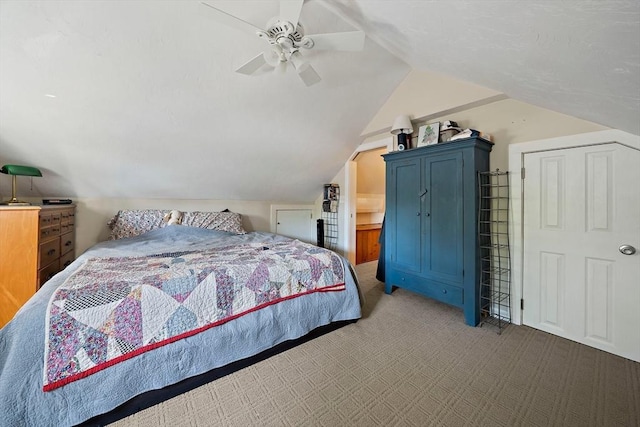 carpeted bedroom featuring vaulted ceiling and a ceiling fan