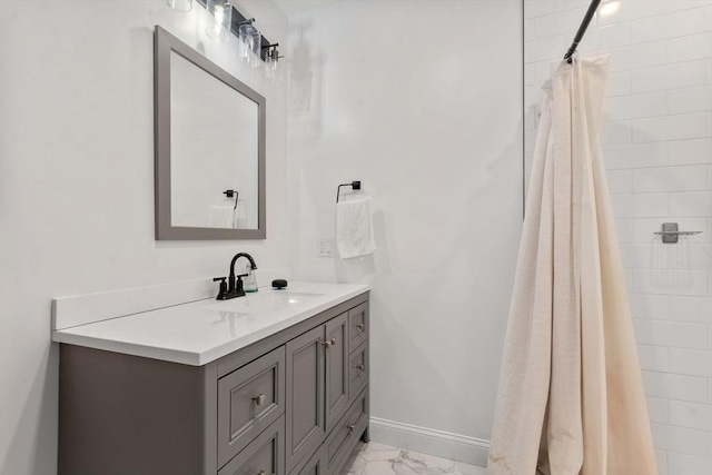 9-11 Dexter, Boston, MA 02127 - bathroom featuring marble finish floors, vanity, and a tile shower