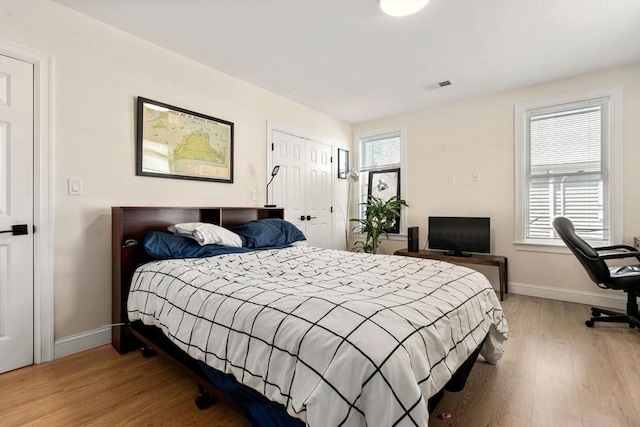 9-11 Dexter, Boston, MA 02127 - bedroom featuring wood finished floors, baseboards, and multiple windows