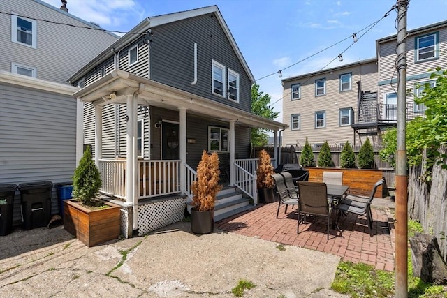 9-11 Dexter, Boston, MA 02127 - back of house with a patio area, a porch, and outdoor dining area