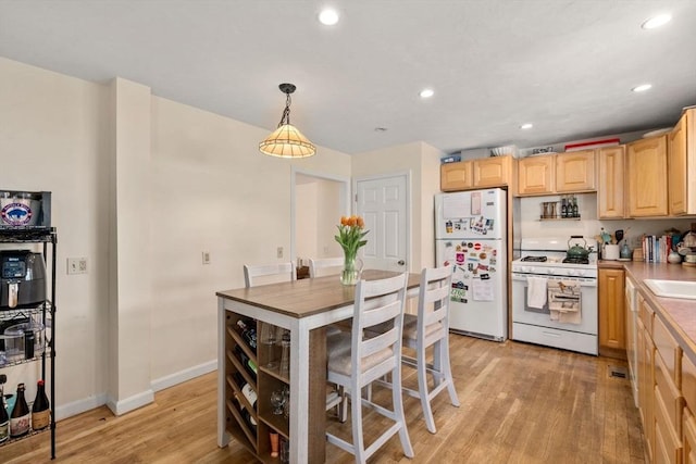 9-11 Dexter, Boston, MA 02127 - kitchen featuring white appliances, light wood-style flooring, light brown cabinets, recessed lighting, and baseboards