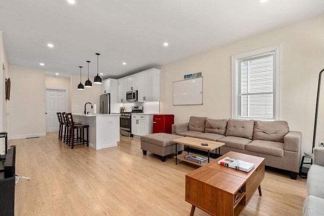 9-11 Dexter, Boston, MA 02127 - living area with light wood-style floors and recessed lighting