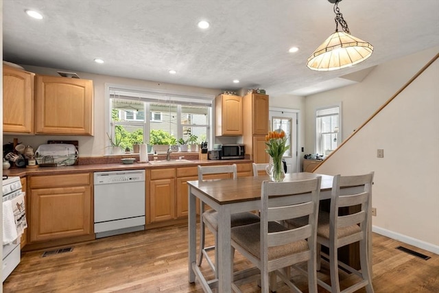 9-11 Dexter, Boston, MA 02127 - kitchen featuring white appliances, light brown cabinets, recessed lighting, a sink, and light wood-style floors