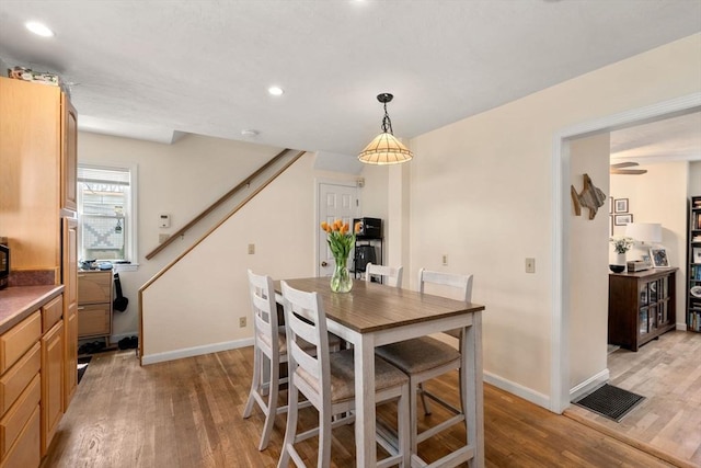 9-11 Dexter, Boston, MA 02127 - dining room with light wood finished floors, baseboards, stairs, and recessed lighting