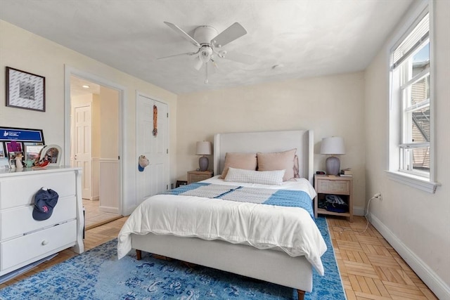 9-11 Dexter, Boston, MA 02127 - bedroom with multiple windows, baseboards, and a ceiling fan
