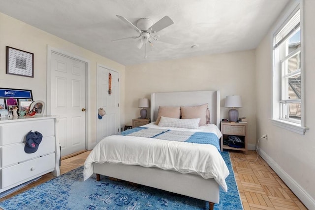 9-11 Dexter, Boston, MA 02127 - bedroom with multiple windows, baseboards, and a ceiling fan