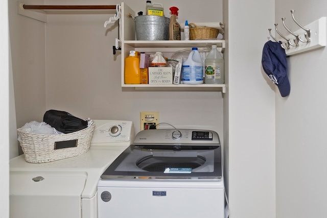 clothes washing area featuring washing machine and dryer