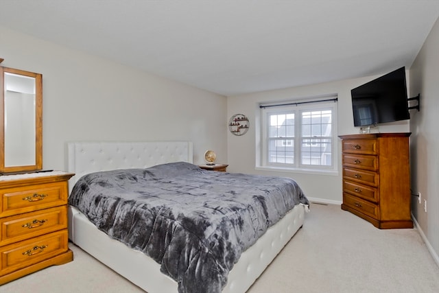 bedroom with light carpet