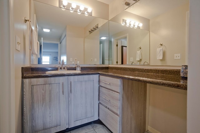 bathroom with vanity and tile patterned floors