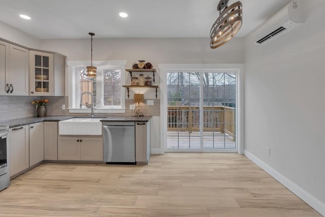 260 Main St Unit 12, Blackstone, MA 01504 - kitchen featuring dishwasher, a wall mounted AC, a sink, backsplash, and healthy amount of natural light