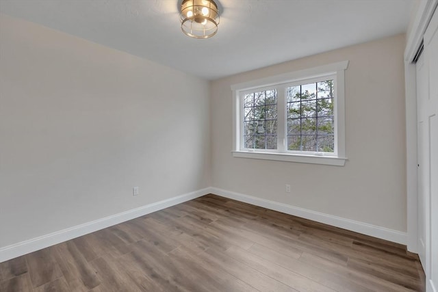 260 Main St Unit 12, Blackstone, MA 01504 - unfurnished bedroom featuring wood finished floors, baseboards, and a closet