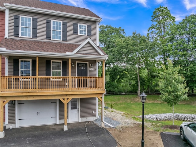 260 Main St Unit 12, Blackstone, MA 01504 - view of front of property with an attached garage, a shingled roof, asphalt driveway, a front lawn, and a porch