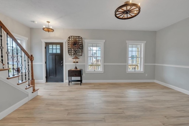 260 Main St Unit 12, Blackstone, MA 01504 - foyer featuring a chandelier, stairs, light wood-type flooring, and baseboards