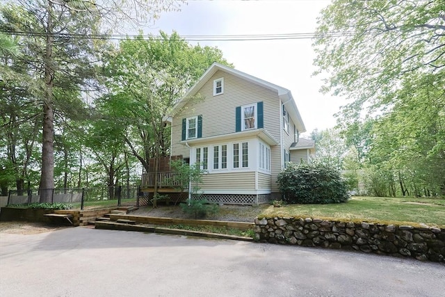 view of front of house featuring a wooden deck