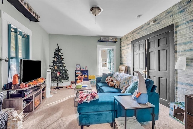 living room with carpet flooring and wooden walls