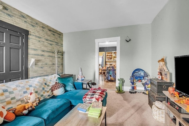 living room with wooden walls and carpet