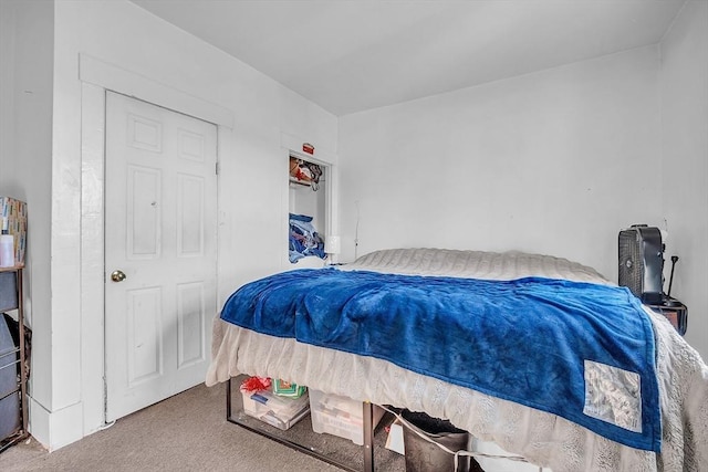 carpeted bedroom with a closet