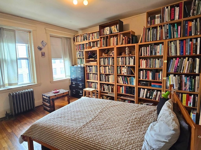 5 Crawford St Unit 9, Cambridge, MA 02139 - bedroom featuring radiator and wood finished floors