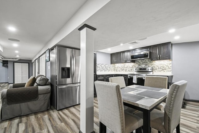 69 Greenwood St, Boston, MA 02122 - dining space with light wood-style flooring and recessed lighting